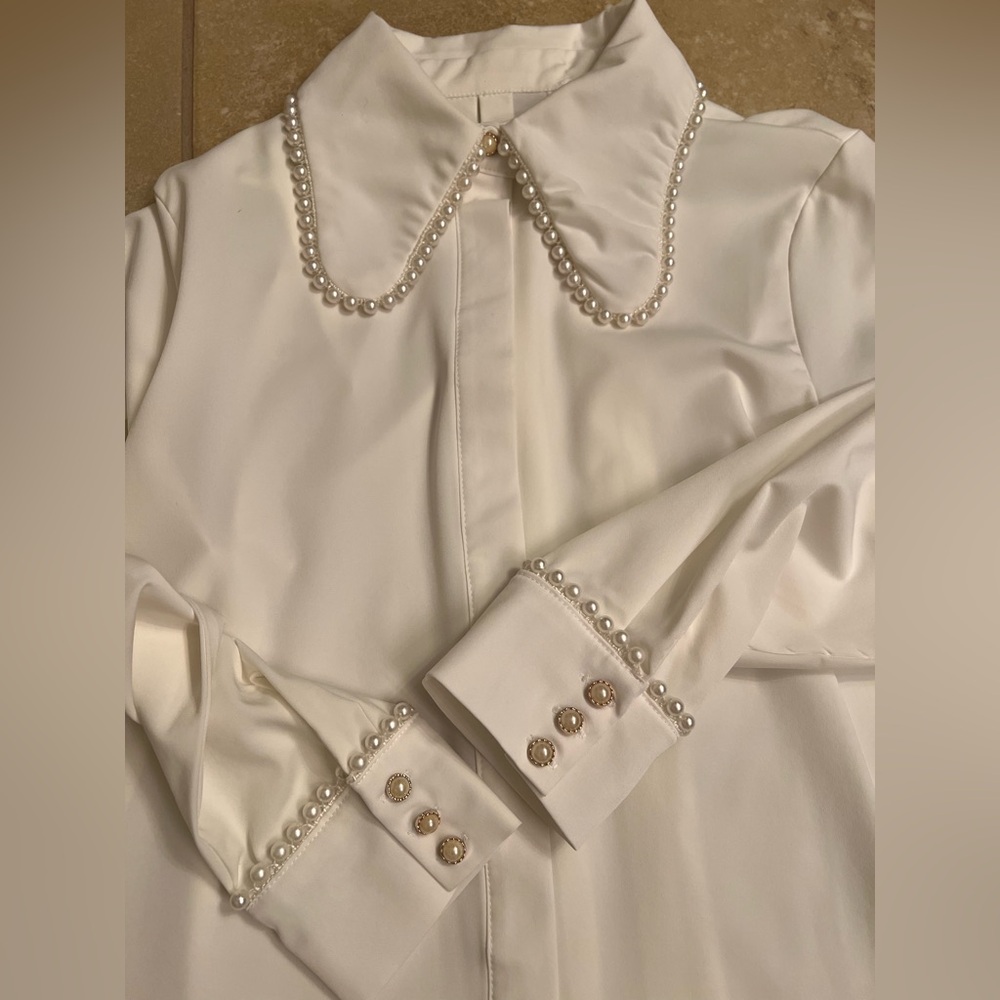 Embellished white blouse